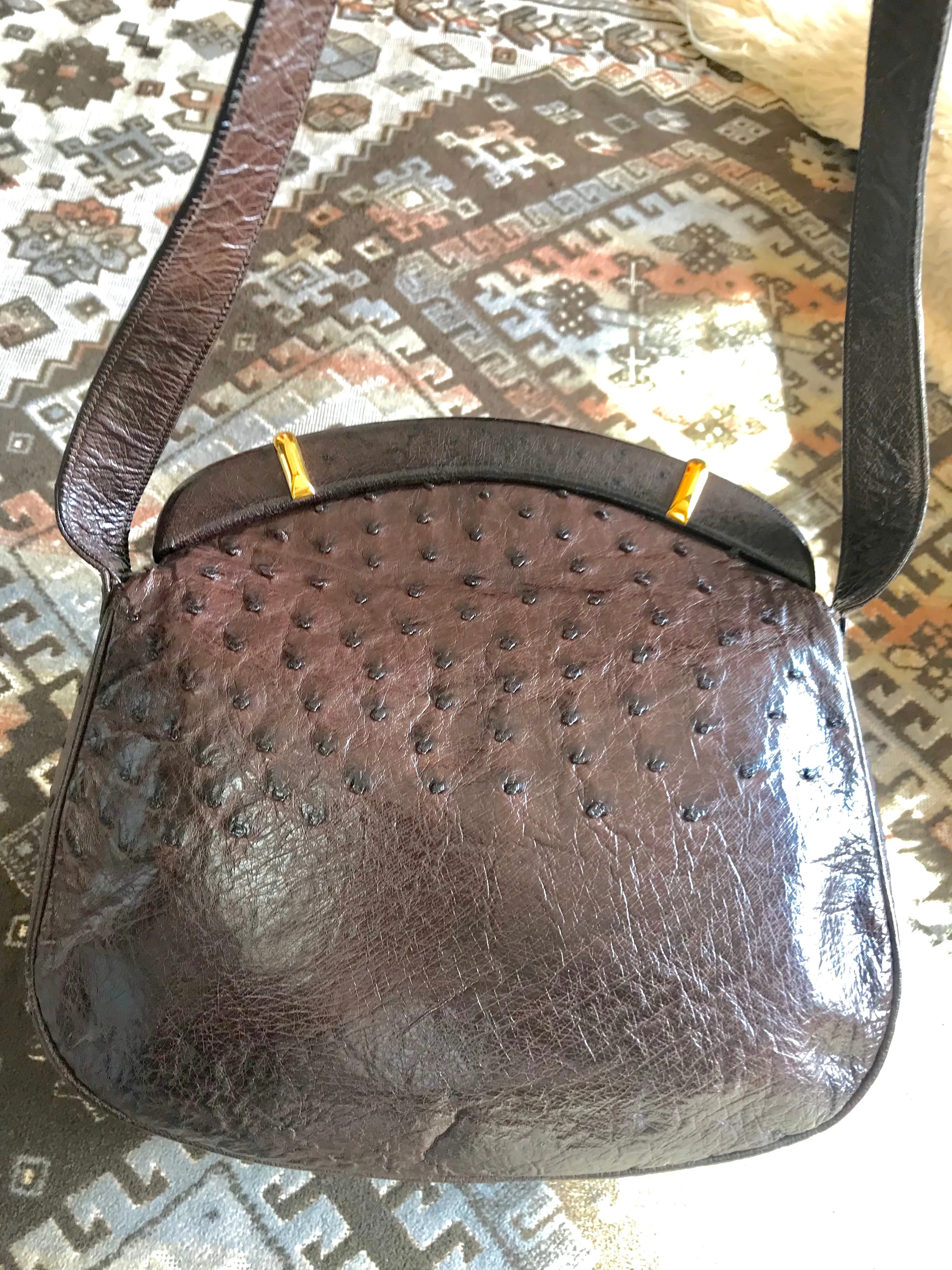 Vintage GUCCI dark brown genuine ostrich leather fisherman bag style shoulder bag with logo embossed motif. Rare masterpiece.