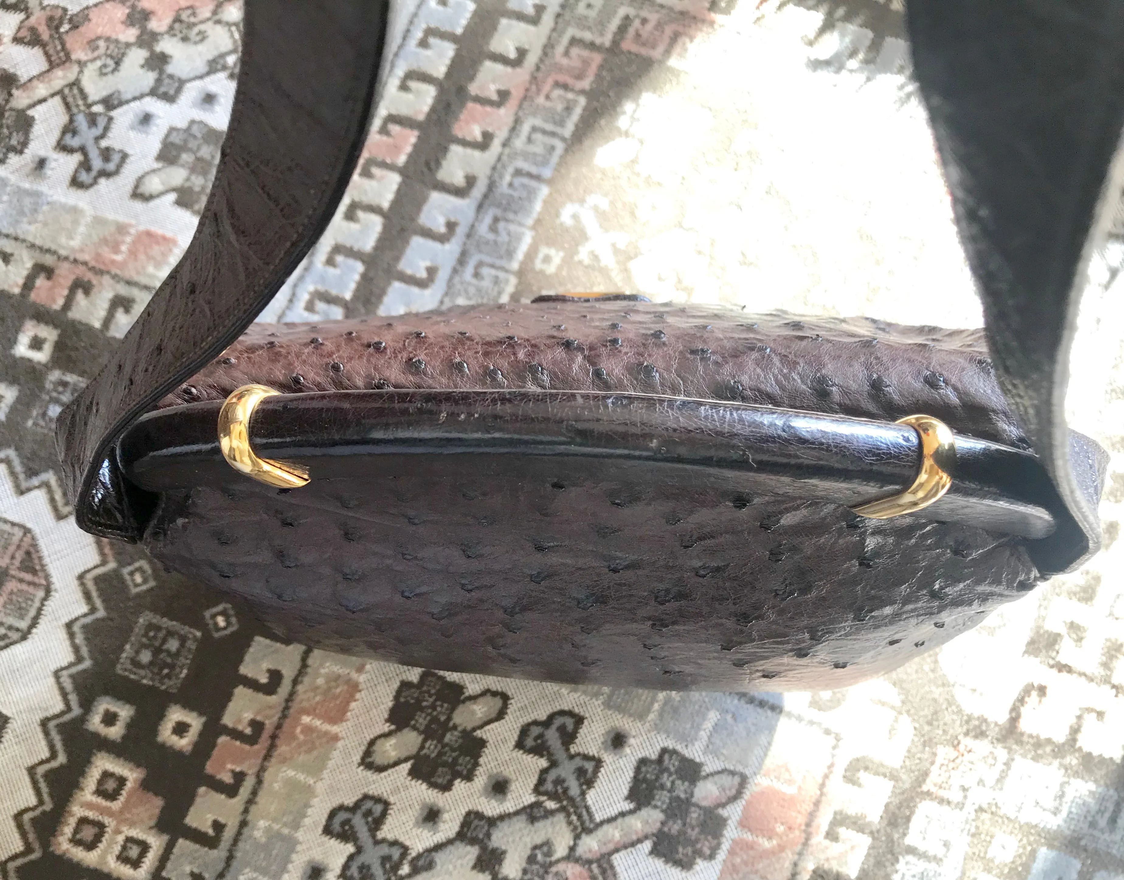 Vintage GUCCI dark brown genuine ostrich leather fisherman bag style shoulder bag with logo embossed motif. Rare masterpiece.
