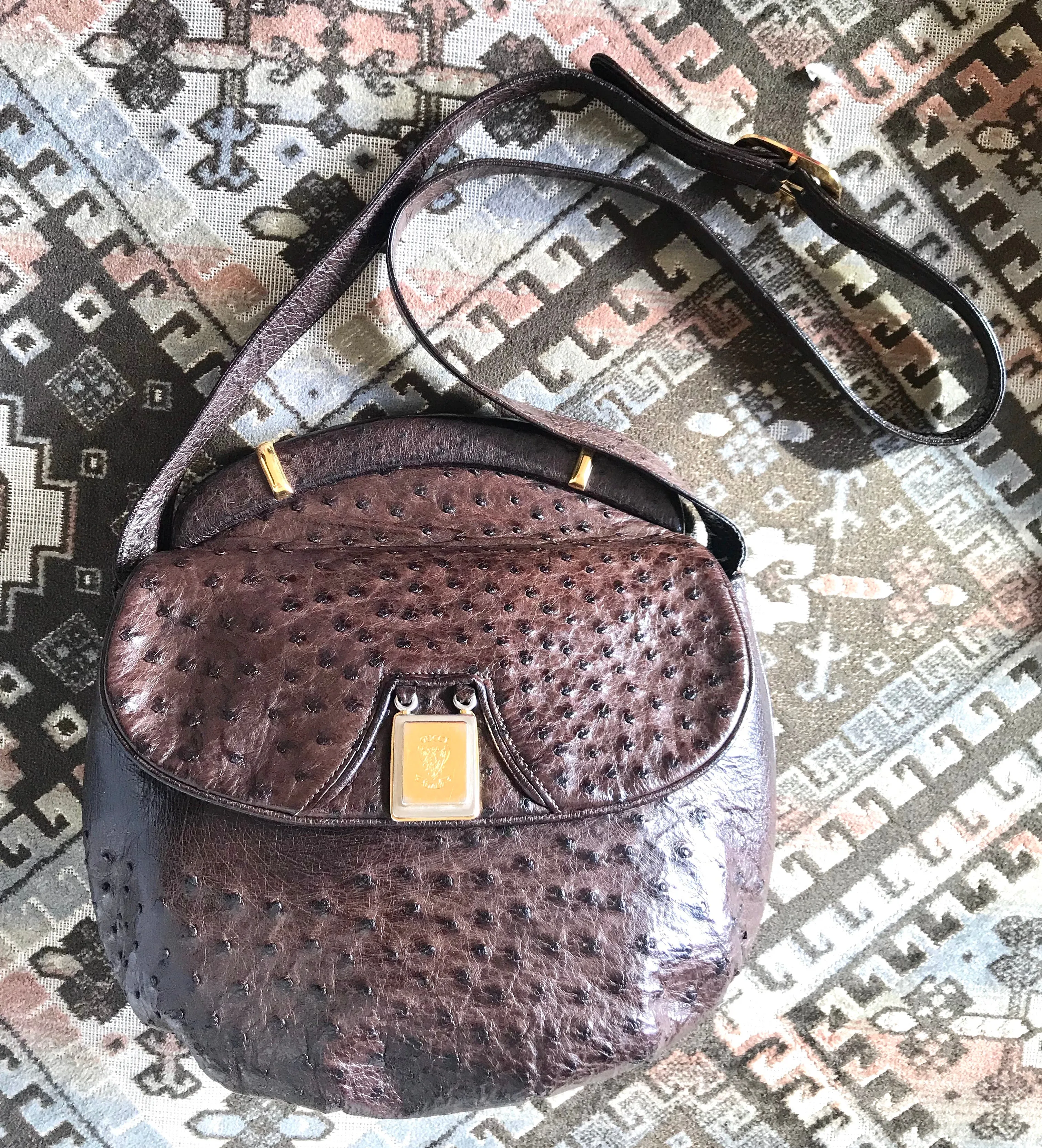 Vintage GUCCI dark brown genuine ostrich leather fisherman bag style shoulder bag with logo embossed motif. Rare masterpiece.