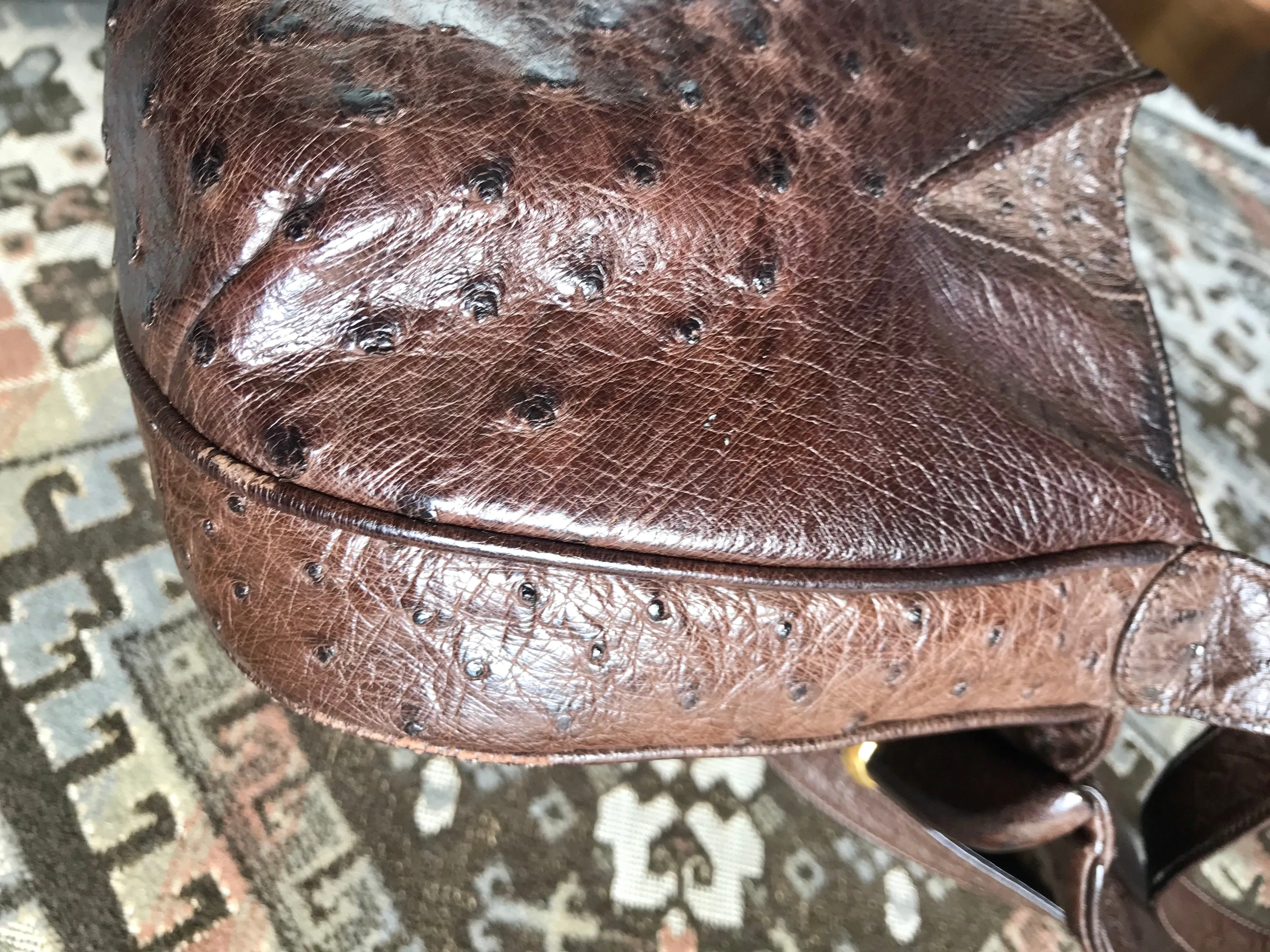 Vintage GUCCI dark brown genuine ostrich leather fisherman bag style shoulder bag with logo embossed motif. Rare masterpiece.