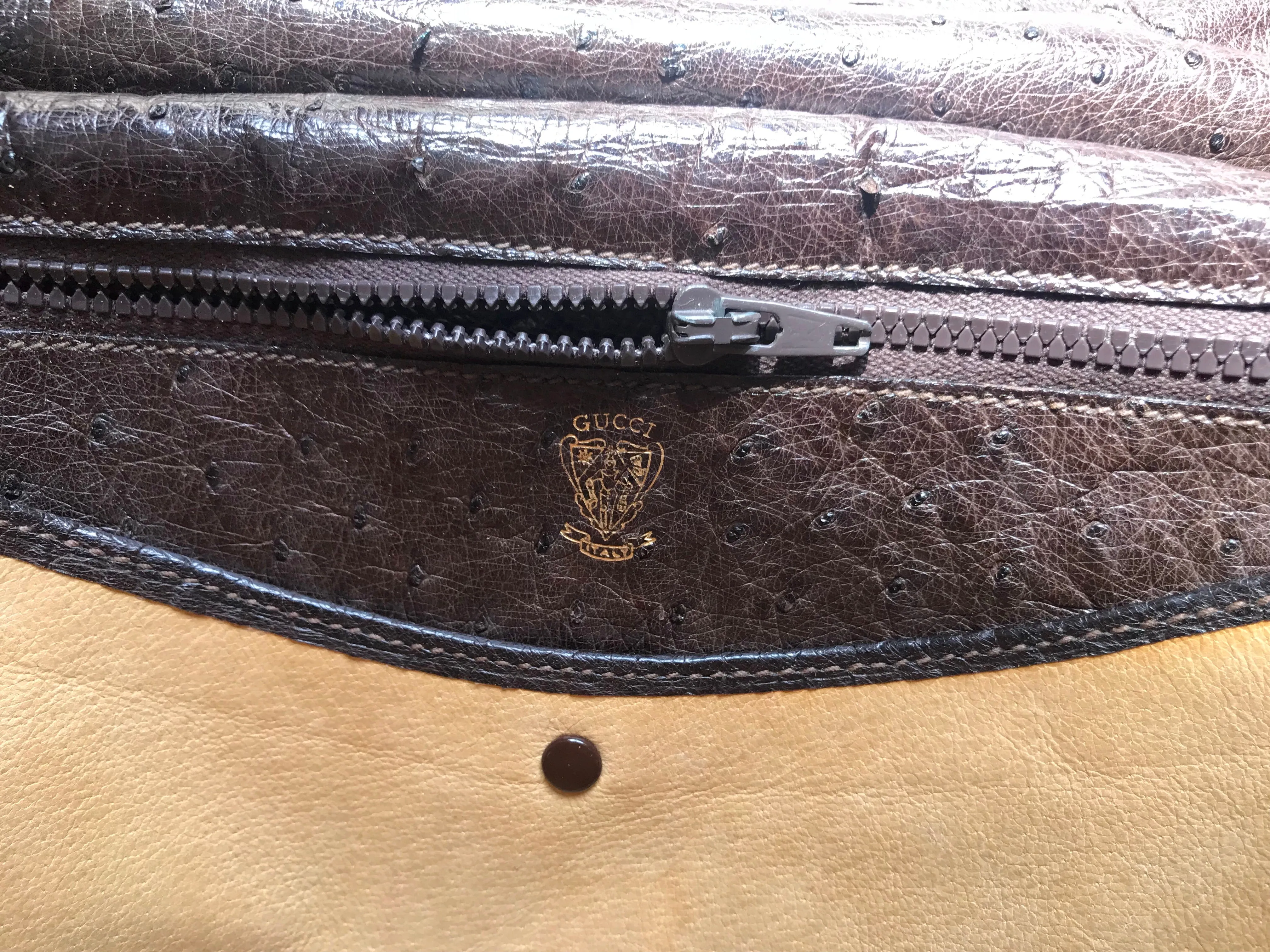 Vintage GUCCI dark brown genuine ostrich leather fisherman bag style shoulder bag with logo embossed motif. Rare masterpiece.