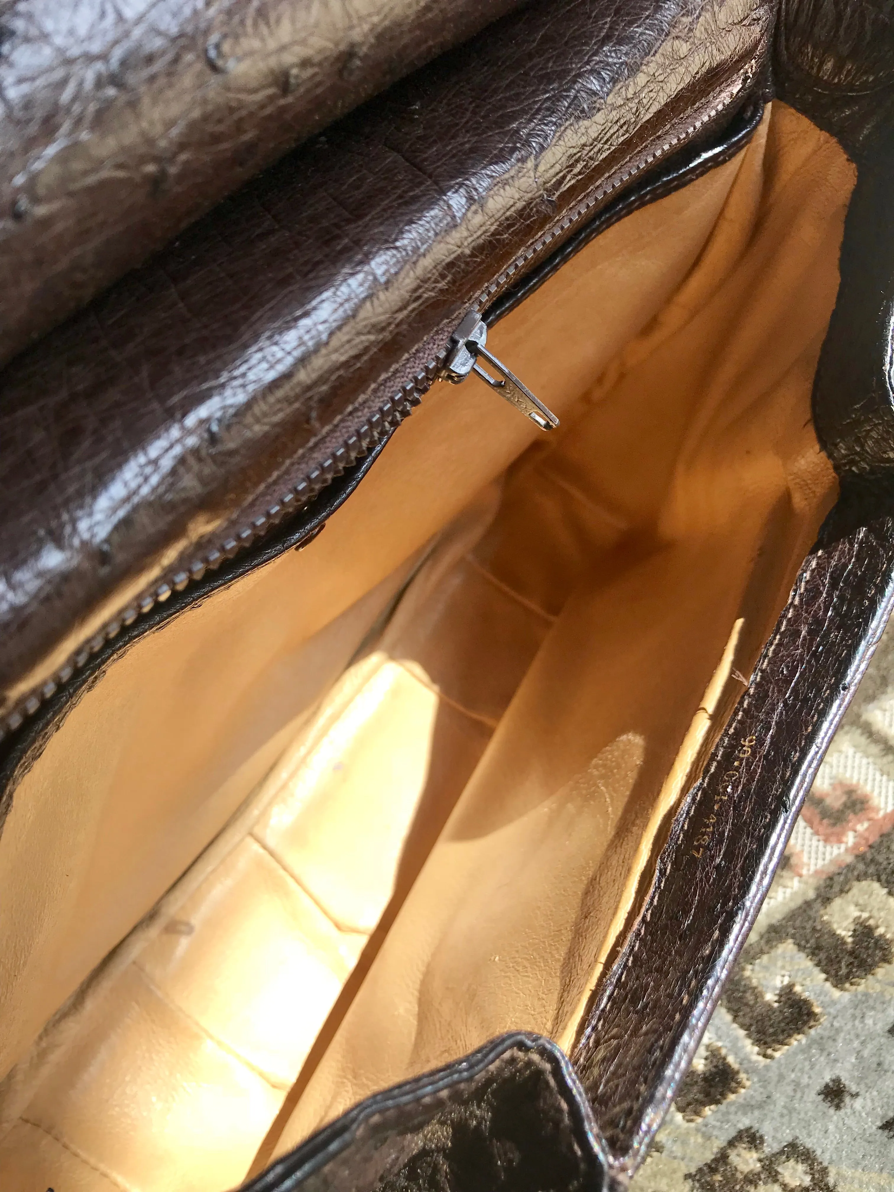 Vintage GUCCI dark brown genuine ostrich leather fisherman bag style shoulder bag with logo embossed motif. Rare masterpiece.