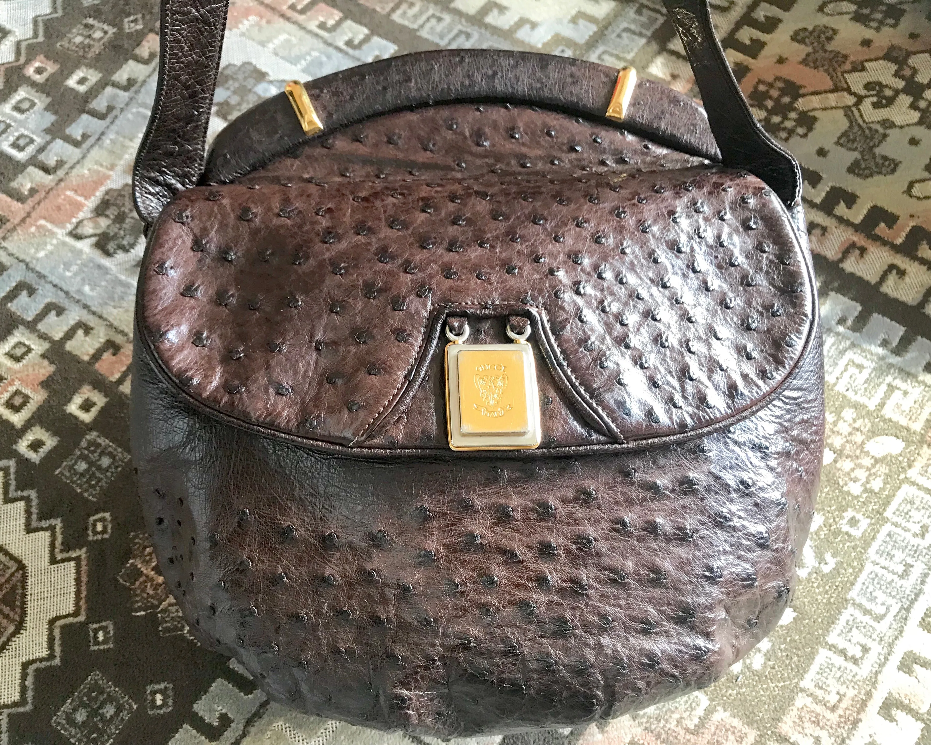 Vintage GUCCI dark brown genuine ostrich leather fisherman bag style shoulder bag with logo embossed motif. Rare masterpiece.