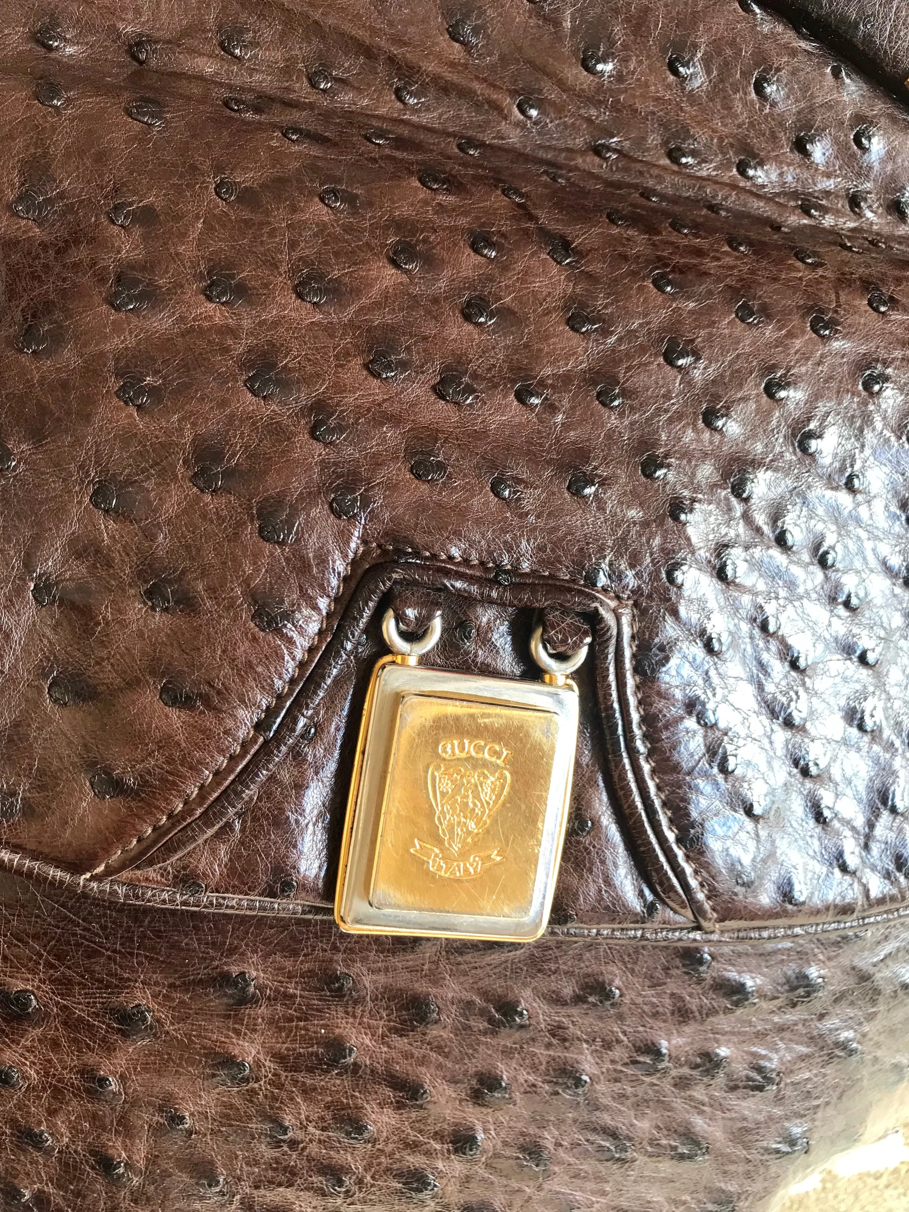 Vintage GUCCI dark brown genuine ostrich leather fisherman bag style shoulder bag with logo embossed motif. Rare masterpiece.